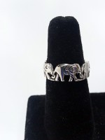 Elephants Holding Tails Ring